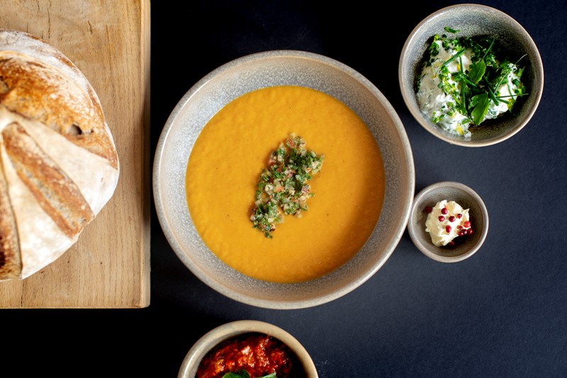 Spiced carrot soup with toasted grains and preserved lemon
