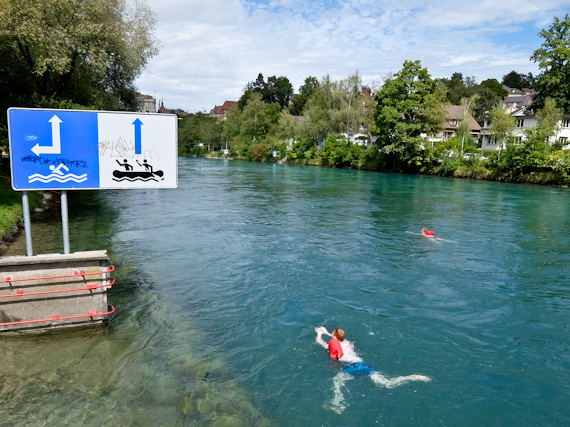 Swimmers with Bags in Aare River