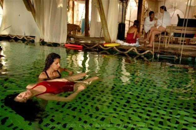 Andy Mossack tries out the ultimate stress reduction therapy as he  goes relaxing with water maidens in Eilat