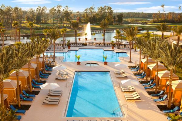 Andy Mossack reviews the Hilton and Waldorf Astoria Hotels adjacent properties in the theme park heart of Orlando.  pool from hotel hr new trees final