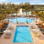 Andy Mossack reviews the Hilton and Waldorf Astoria Hotels adjacent properties in the theme park heart of Orlando.  pool from hotel hr new trees final