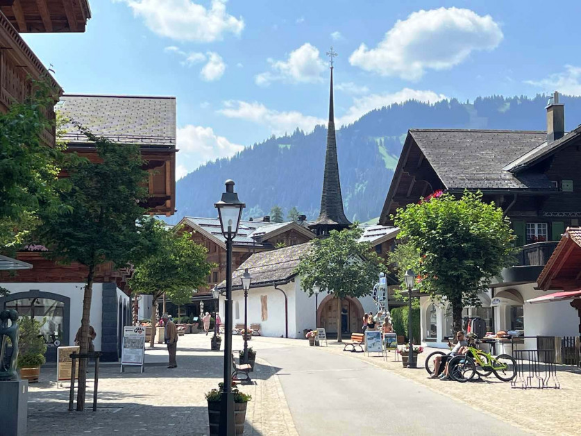 Switzerland, Bern, Gstaad, cow-bells used as decoration of a wood