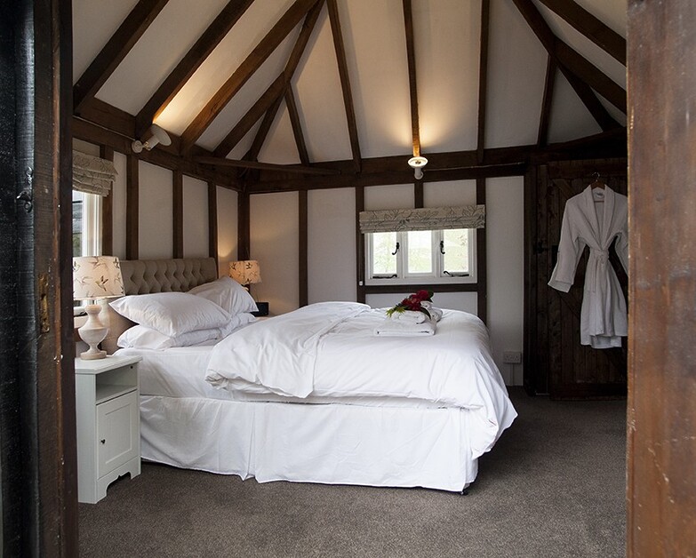 Michael Edwards stays at Old Luxters Farmhouse, sipping wine poolside, possibly England’s most luxurious “shed.”