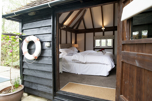 Michael Edwards stays at Old Luxters Farmhouse, sipping wine poolside, possibly England’s most luxurious “shed.”