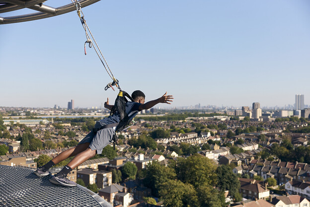 Andy Mossack enjoys a morning out with the family on the Dare Skywalk almost 50 metres above the ground at the top of the Spurs stadium.